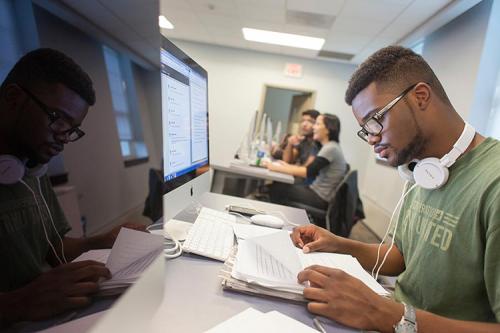 A student studies at a computer.