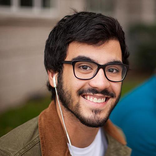 A student smiles towards the camera.