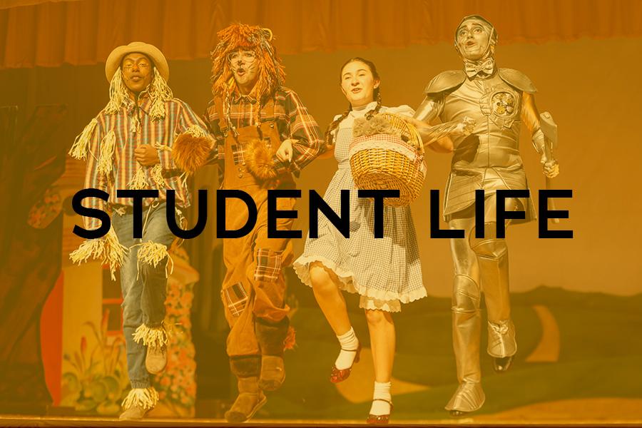 Four students perform The Wizard of Oz.