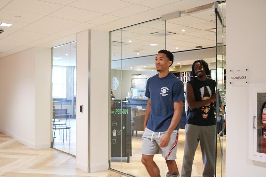 Students exit the Starbucks in the LaPenta Student Union.