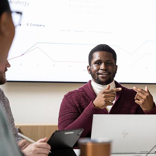 An MBA student works on a project in LSB.