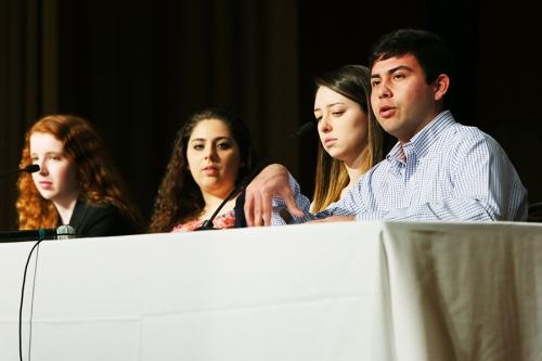 Students present at a conference.