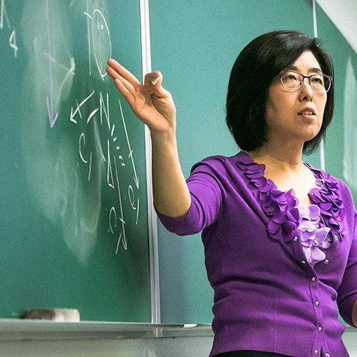 Dr. Lee teaches at the blackboard.