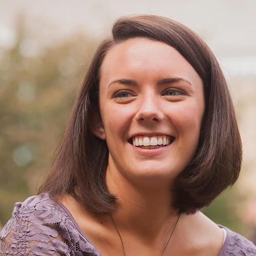 A special education student smiles. 