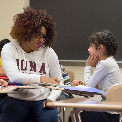 Teacher sharing moment with adolescent student