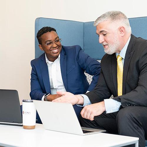 Two MBA students work together in the LSB.