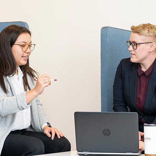 Two MBA students work together in the LSB.