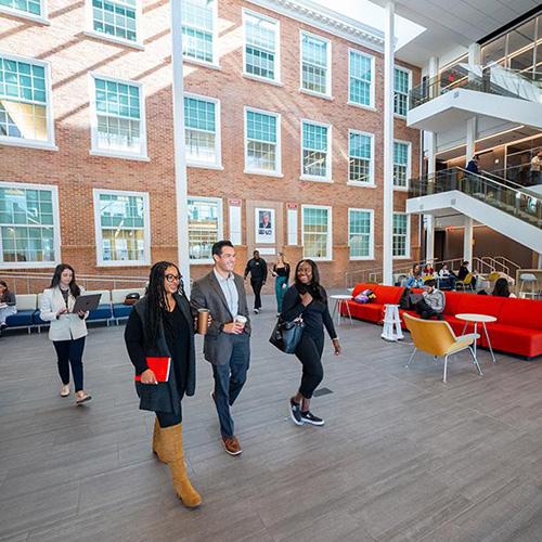Students walking in the LSB atrium.
