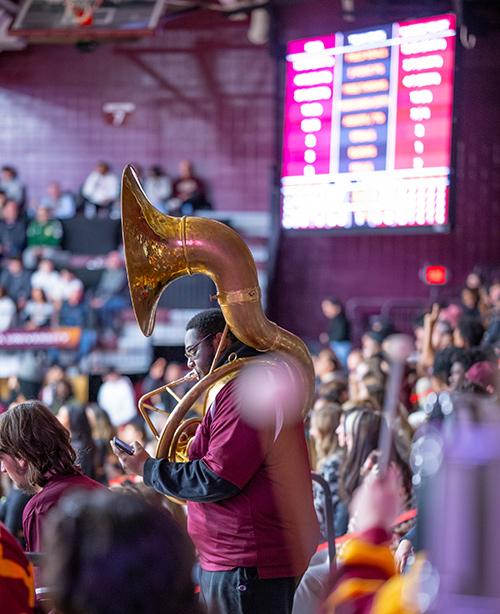 The tuba player in the Pep Band plays on gameday.