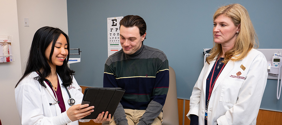 A FNP student and professor practice explaining test results.