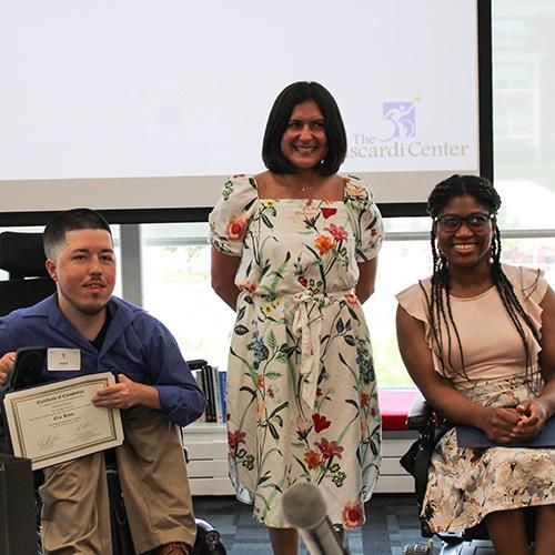 Two Viscardi participants pose and hold their certificates.