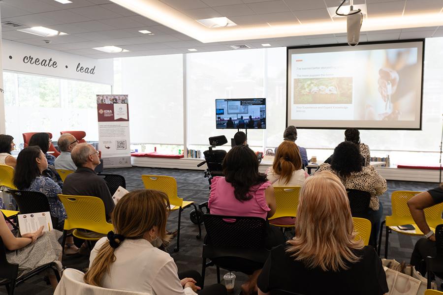 Presenters and audience during a presentation at IdeaSpark.