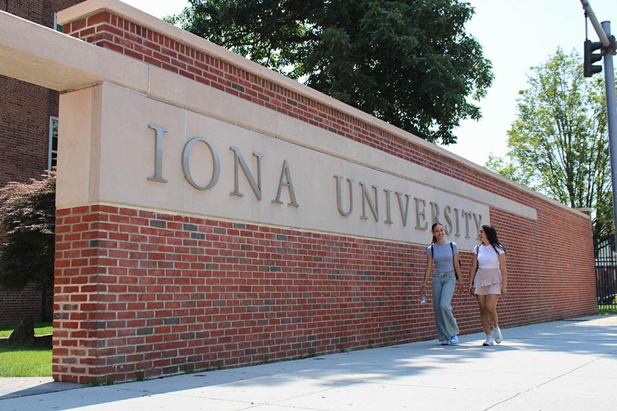 Two students walk near the North Ave. entrance.