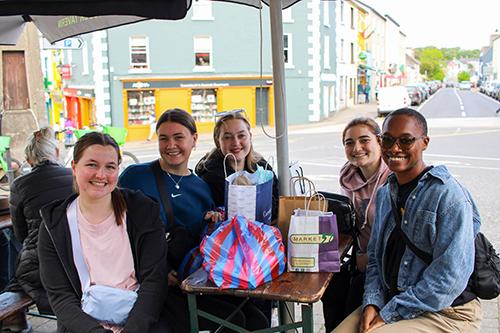 A group relaxes at a cafe in Westport, Ireland.
